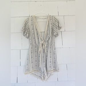 White and black printed romper with tie front